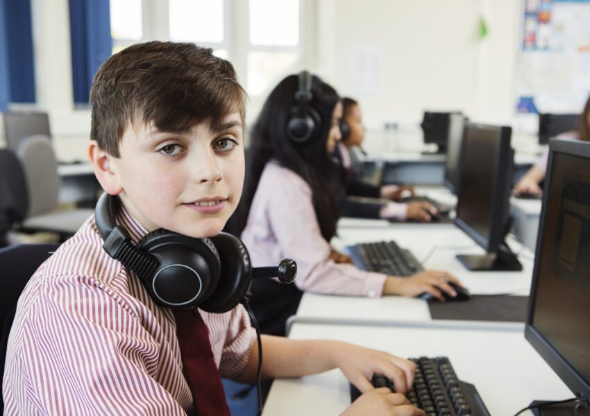 Students using computer in classroom